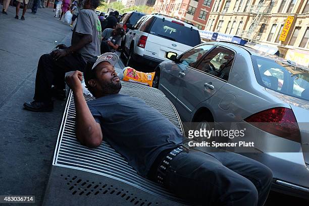 Men who are high on K2 or "Spice", a synthetic marijuana drug, sleep along a street in East Harlem on August 5, 2015 in New York City. New York,...