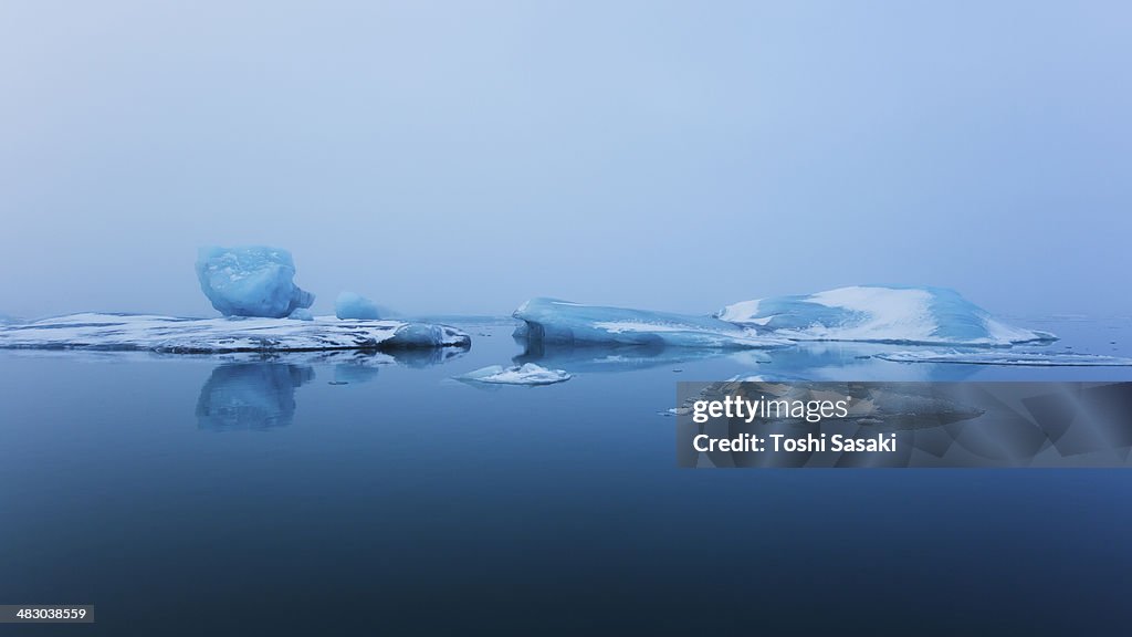 Drifting glaciers at calm Jokulsarlon, Iceland