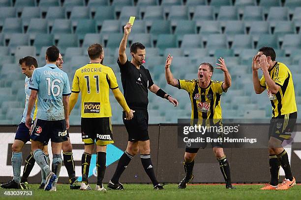 Benjamin Sigmund of the Phoenix reacts after receiving a yellow card during the round 26 A-League match between Sydney FC and the Wellington Phoenix...