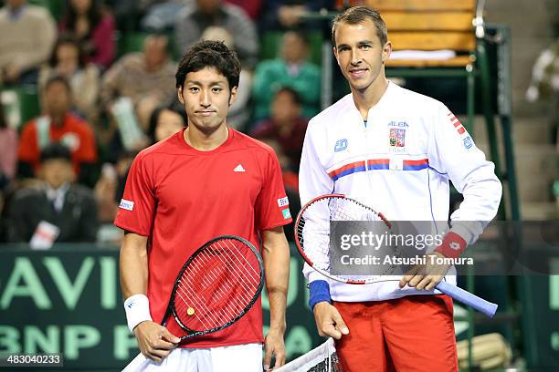 Yasutaka Uchiyama of Japan and Lukas Rosol of Czech Republic pose prior to their singles match during day three of the Davis Cup World Group Quarter...