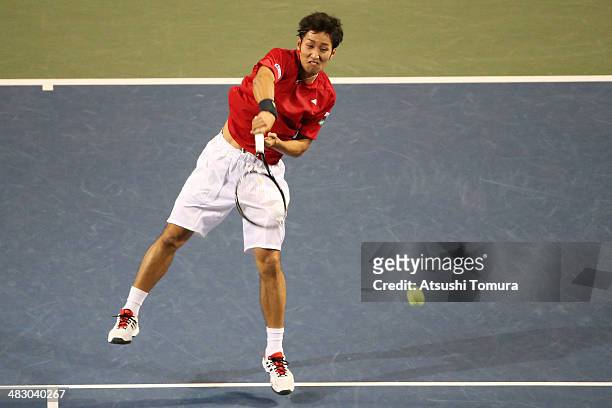 Yasutaka Uchiyama of Japan plays a forehand during his match against Lukas Rosol of the Czech Republic during day three of the Davis Cup World Group...