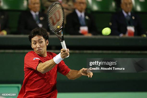 Yasutaka Uchiyama of Japan plays a forehand during his match against Lukas Rosol of the Czech Republic during day three of the Davis Cup World Group...