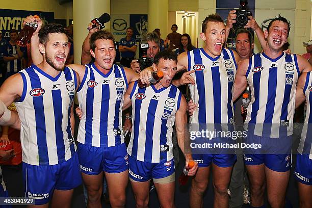 Aaron Black, Brad McKenzie, Brent Harvey, Drew Petrie and Todd Goldstein of the Kangaroos celebrate their win during the round three AFL match...