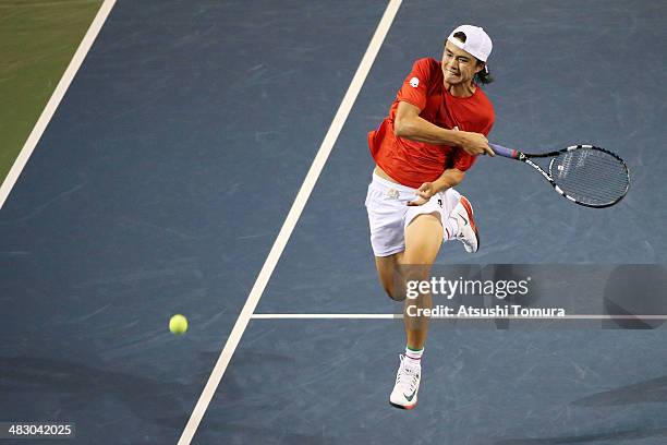 Taro Daniel of Japan plays a forehand during his match against Jiri Vesely of the Czech Republic during day three of the Davis Cup World Group...