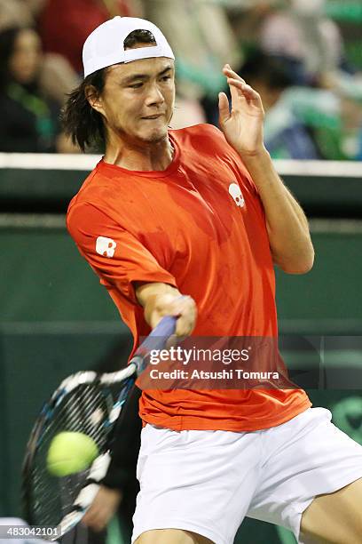 Taro Daniel of Japan plays a forehand during his match against Jiri Vesely of the Czech Republic during day three of the Davis Cup World Group...