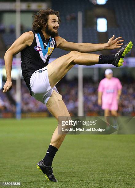 John Butcher of the Power kicks the ball during the round three AFL match between the North Melbourne Kangaroos and the Port Adelaide Power at Etihad...