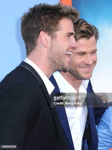 Actors/brothers Liam Hemsworth and Chris Hemsworth arrive at the Premiere Of Warner Bros. 'Vacation' at Regency Village Theatre on July 27, 2015 in...