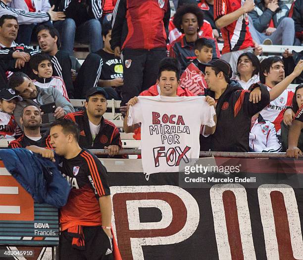 Fan of River Plate displays a t-shirt mocking Boca Juniors prior a second leg final match between River Plate and Tigres UANL as part of Copa...
