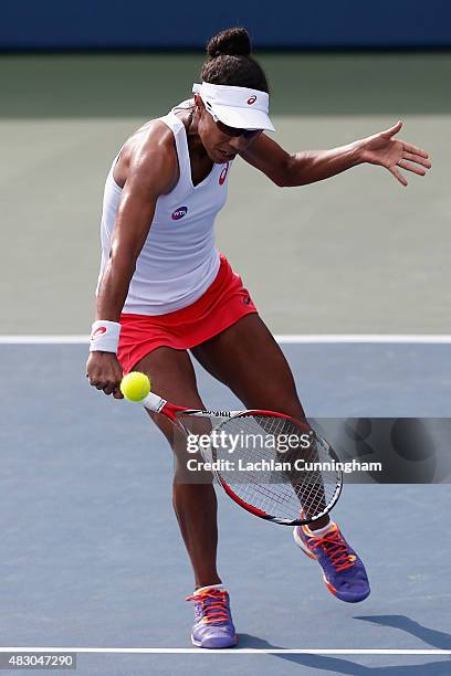 Raquel Kops-Jones of the United States plays in her doubles match with Maria Sanchez of the United States against Mona Barthel and Sabine Lisicki of...