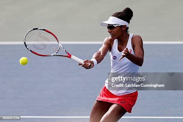 Raquel Kops-Jones of the United States plays in her doubles match with Maria Sanchez of the United States against Mona Barthel and Sabine Lisicki of...