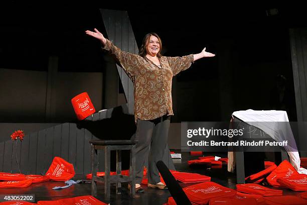 Actress Myriam Boyer acknowledges the applause of the audience whyle the traditional throw of cushions at the final of the 'Chere Helena' Theater...