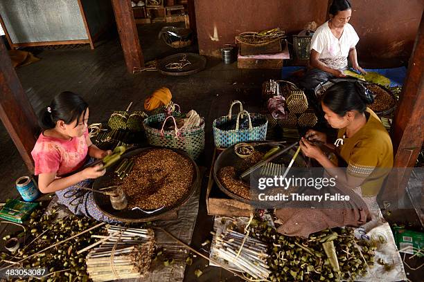 Women make cheroots, the traditional Myanmar cigar, in a workshop on Inle Lake.