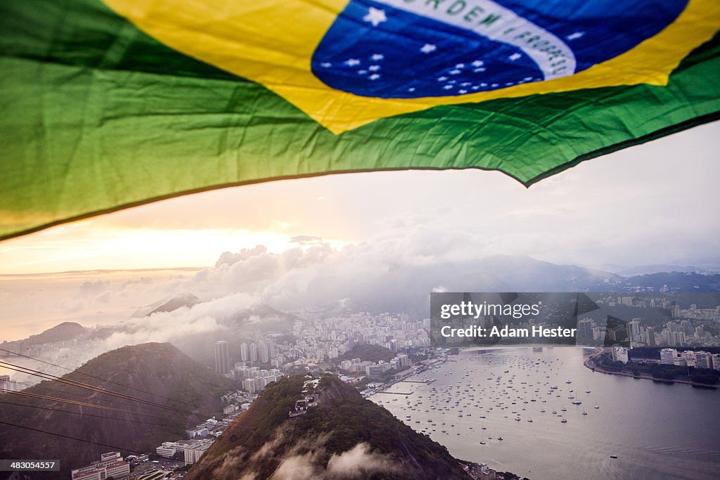 A brazilian flag flying over the top of Rio Brazil