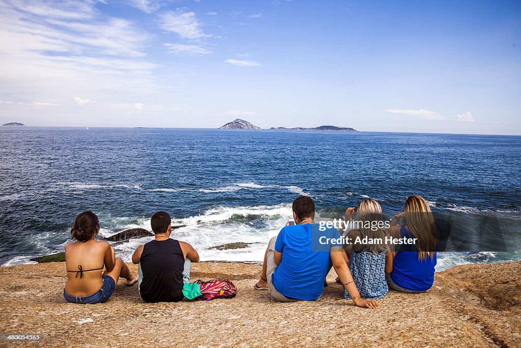 People having fun and relaxing on Ipanema Beach.