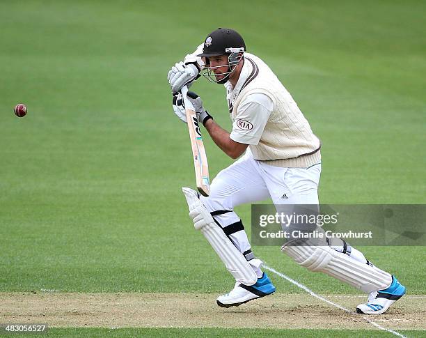 Graeme Smith of Surrey watches his shot race away during day one of the LV County Championship match between Surrey and Glamorgan at The Kia Oval on...