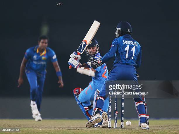 Angelo Mathews of Sri Lanka looks on as he bowls Ajinkya Rahane of India during the Final of the ICC World Twenty20 Bangladesh 2014 between India and...