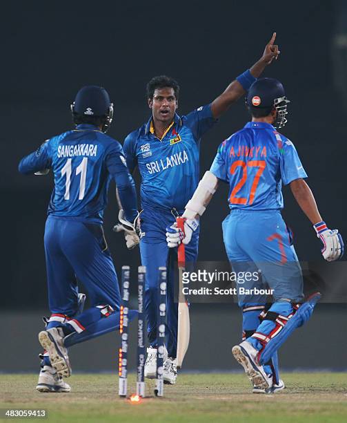 Angelo Mathews of Sri Lanka celebrates after dismissing Ajinkya Rahane of India during the Final of the ICC World Twenty20 Bangladesh 2014 between...