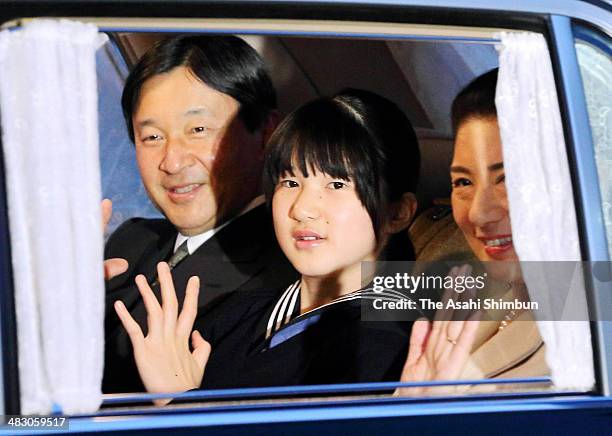 Crown Prince Naruhito, Princess Aiko and Crown Princess Masako wave to media reporters as they visit the Imperial Palace after the Gakushiun Girls'...
