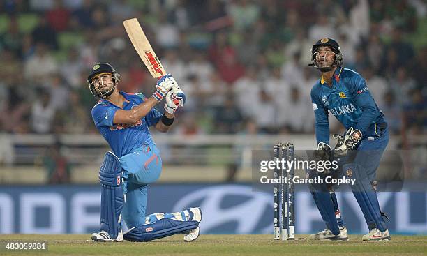 Virat Kohli of India hits out for six runs during the ICC World Twenty20 Bangladesh 2014 Final between India and Sri Lanka at Sher-e-Bangla Mirpur...