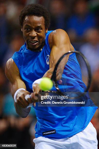 Gael Monfils of France plays a backhand in his match against Peter Gojowczyk of Germany during day 3 of the Davis Cup Quarter Final match between...