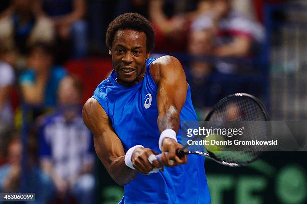 Gael Monfils of France plays a backhand in his match against Peter Gojowczyk of Germany during day 3 of the Davis Cup Quarter Final match between...