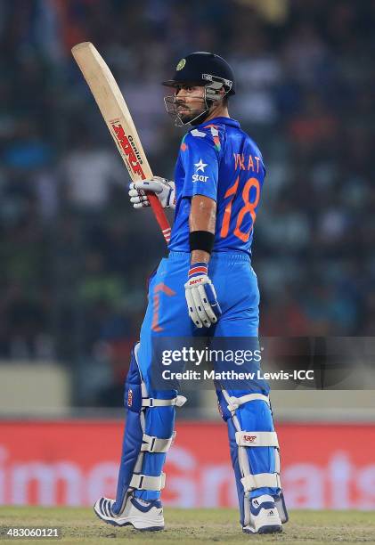 Virat Kohli of India celebrates his half century during the ICC World Twenty20 Bangladesh 2014 Final between India and Sri Lanka at Sher-e-Bangla...