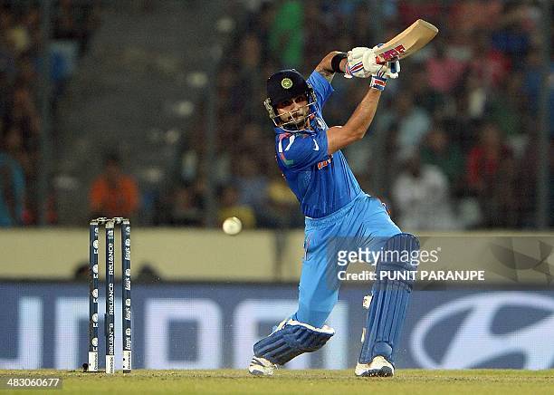 Indian batsman Virat Kohli plays a shot during the ICC World Twenty20 cricket tournament final match between India and Sri Lanka at The Sher-e-Bangla...