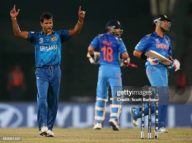 Nuwan Kulasekara of Sri Lanka celebrates after dismissing Yuvraj Singh of India during the Final of the ICC World Twenty20 Bangladesh 2014 between...