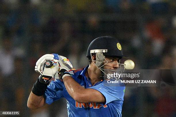 Indian cricketer Yuvraj Singh keeps his eyes on the ball as he plays a shot during the ICC World Twenty20 cricket tournament final match between...