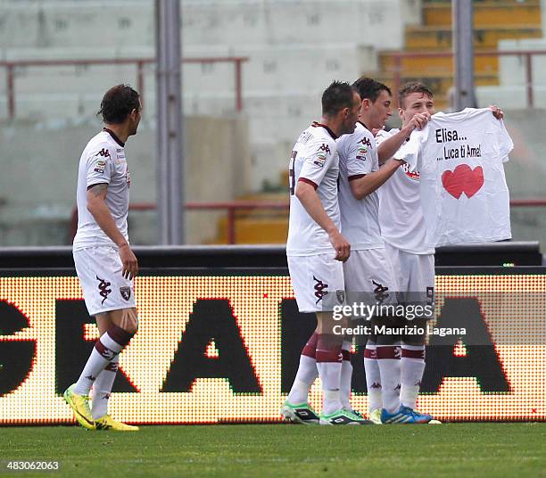 Ciro Immobile of Torino celebrates after scoring the winning goal by holding up a t-shirt that says 'Elisa......Luca Loves You' during the Serie A...