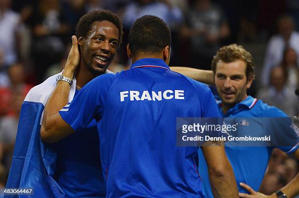 Gael Monfils of France celebrates with team mates after winning his match against Peter Gojowczyk of Germany during day 3 of the Davis Cup Quarter...