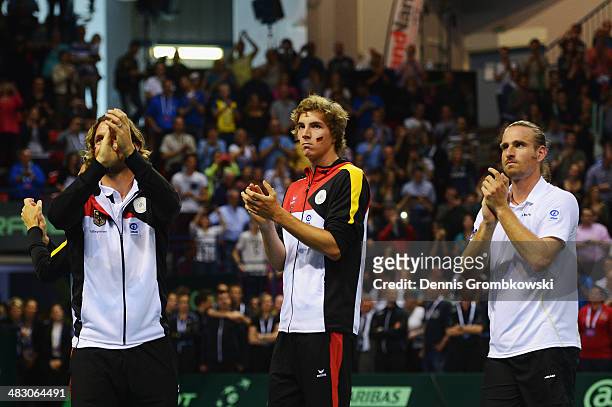 The team of Germany look dejected after day 3 of the Davis Cup Quarter Final match between France and Germany on April 6, 2014 in Nancy, France.