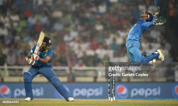 Mahendra Singh Dhoni of India celebrates catching out Lahiru Thirimanne of Sri Lanka during the ICC World Twenty20 Bangladesh 2014 Final between...