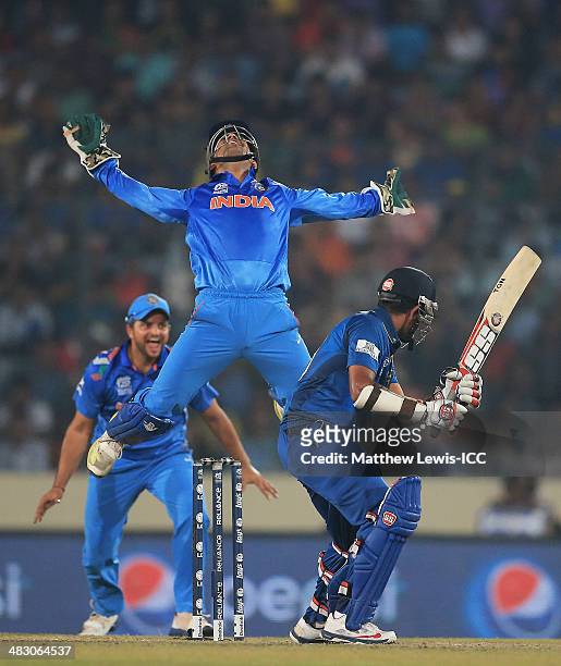 Mahendra Singh Dhoni of India celebrates catching Lahiru Thirimanne of Sri Lanka, off the bowling of Amit Mishra during the ICC World Twenty20...
