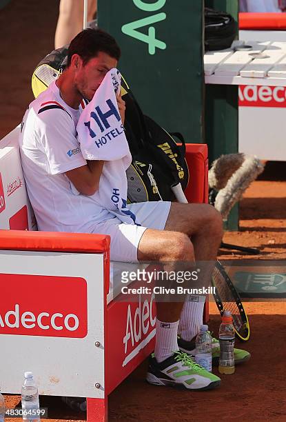 James Ward of Great Britain shows his dejection in the change over during the fifth and decisive rubber against Andreas Seppi of Italy during day...