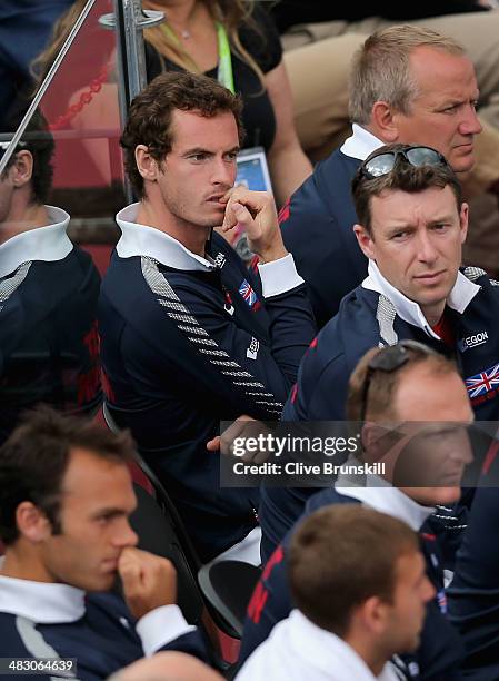 Andy Murray of Great Britain shows his frustration as he watches team mate James Ward during the fifth and decisive rubber against Andreas Seppi of...