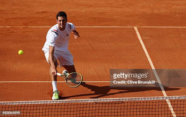 James Ward of Great Britain plays a backhand volley during the fifth and decisive rubber against Andreas Seppi of Italy during day three of the Davis...