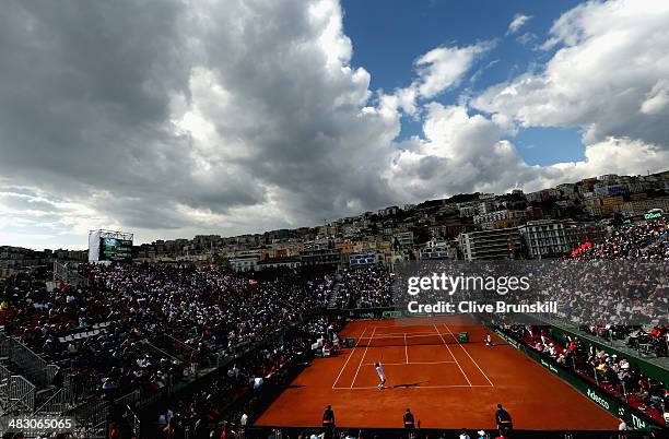 General view of the Tennis Club Napoli court with storm clouds as James Ward of Great Britain serves in the fifth and decisive rubber against Andreas...