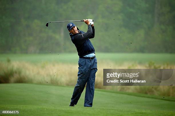 Matt Kuchar of the United States hits his second shot on the seventh hole during the final round of the Shell Houston Open at the Golf Club of...