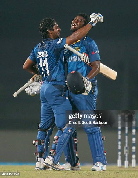 Kumar Sangakkara and Thisara Perera of Sri Lanka celebrates as Sri lanka win the Final of the ICC World Twenty20 Bangladesh 2014 between India and...