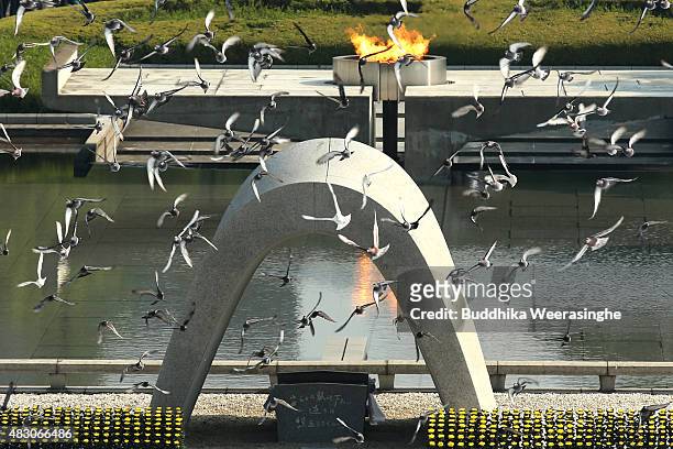 Doves are released as a sign of peace during the Hiroshima Peace Memorial Ceremony at the Hiroshima Peace Memorial Park on the day of the 70th...