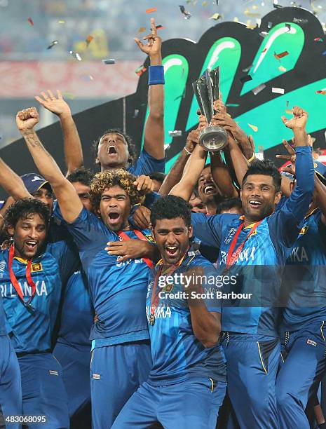 Lasith Malinga of Sri Lanka and his team celebrate with the trophy on the podium after winning the Final of the ICC World Twenty20 Bangladesh 2014...