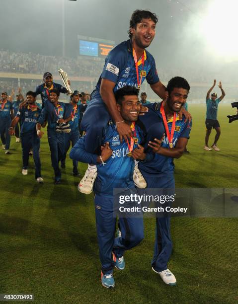 Kumar Sangakkara of Sri Lanka is chaired from the field by Seekuge Prasanna and Kusal Perera after winning the ICC World Twenty20 Bangladesh 2014...