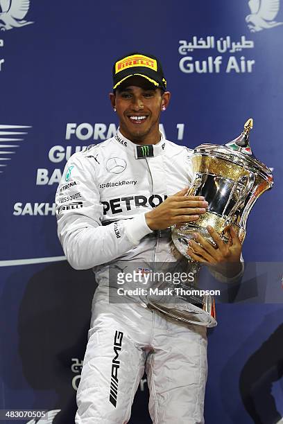 Lewis Hamilton of Great Britain and Mercedes GP celebrates on the podium after winning the Bahrain Formula One Grand Prix at the Bahrain...