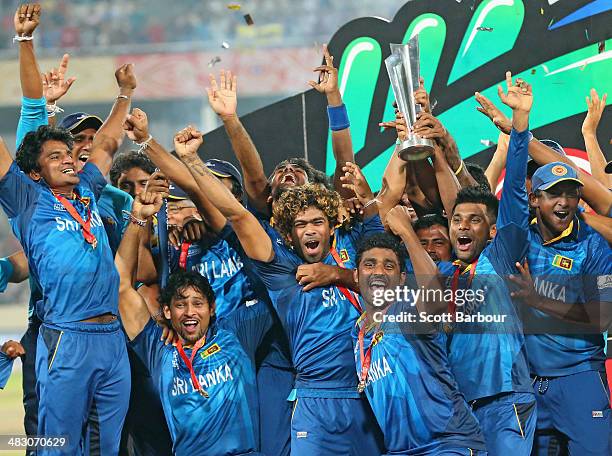 Lasith Malinga of Sri Lanka and his team celebrate with the trophy on the podium after winning the Final of the ICC World Twenty20 Bangladesh 2014...