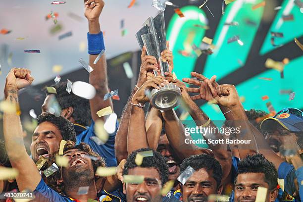 Lasith Malinga of Sri Lanka and his team celebrate with the trophy on the podium after winning the Final of the ICC World Twenty20 Bangladesh 2014...