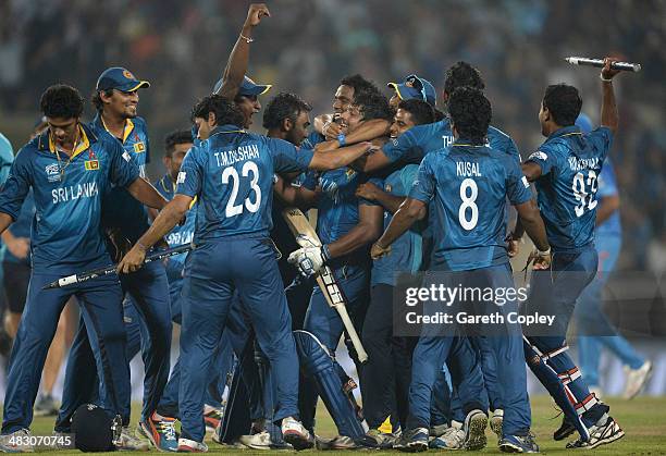 Kumar Sangakkara of Sri Lanka is mobbed by teammates in celebration after winning the ICC World Twenty20 Bangladesh 2014 Final between India and Sri...