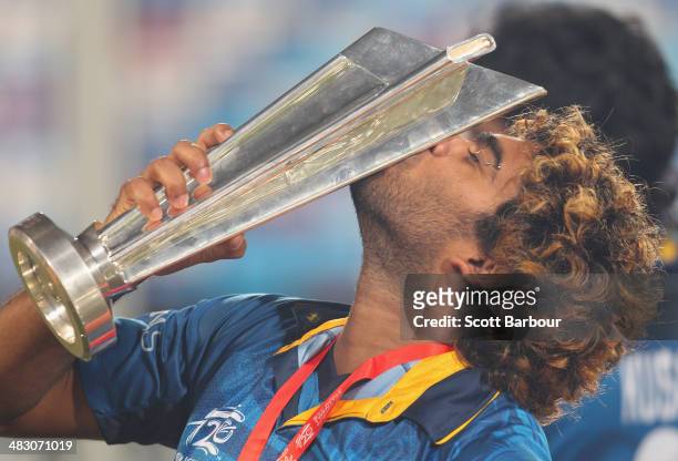 Lasith Malinga of Sri Lanka kisses the trophy after winning the Final of the ICC World Twenty20 Bangladesh 2014 between India and Sri Lanka at...