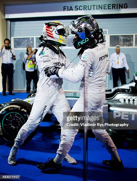 Lewis Hamilton of Great Britain and his team mate Nico Rosberg of Germany and Mercedes GP Petronas celebrate after finishing first and second during...