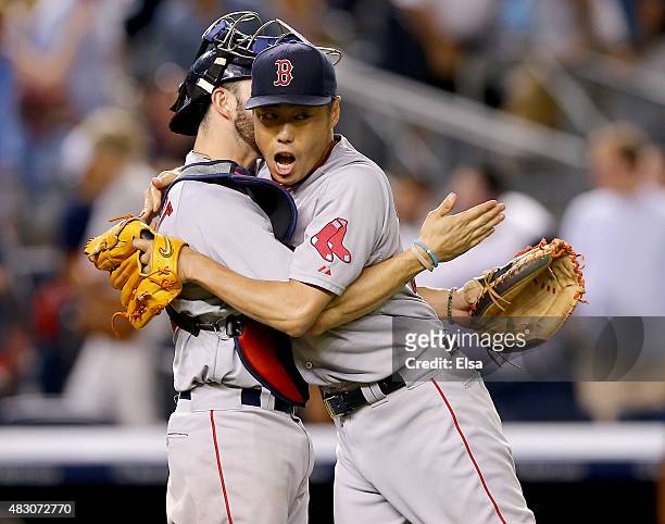 Blake Swihart and Koji Uehara of the Boston Red Sox celebrate the win over the New York Yankees on August 5, 2015 at Yankee Stadium in the Bronx...